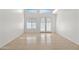 Inviting living room with tile flooring, high ceilings, and natural light at 2206 S 114Th Ln, Avondale, AZ 85323