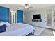 The main bedroom featuring an ensuite bathroom, and a TV mounted on the wall at 2221 W Madisen Marie Ave, Queen Creek, AZ 85144
