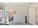This room features a closet, a window, wood-look floors and neutral paint at 2221 W Madisen Marie Ave, Queen Creek, AZ 85144