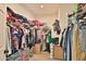 Spacious walk-in closet with ample storage space for clothes, shoes and more at 2221 W Madisen Marie Ave, Queen Creek, AZ 85144