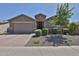 Charming single-story home featuring a brick driveway and desert landscaping at 2221 W Madisen Marie Ave, Queen Creek, AZ 85144