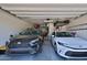 Garage showing two cars and overhead storage at 2221 W Madisen Marie Ave, Queen Creek, AZ 85144