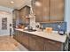 Well-equipped kitchen with a gas cooktop, stainless steel appliances, and ample cabinet space at 2221 W Madisen Marie Ave, Queen Creek, AZ 85144