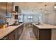 Spacious kitchen featuring a modern layout with an island, adjacent to the dining area for easy access at 2221 W Madisen Marie Ave, Queen Creek, AZ 85144