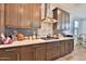 Kitchen with stylish backsplash, modern appliances, and lots of counter space at 2221 W Madisen Marie Ave, Queen Creek, AZ 85144