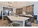 Beautiful kitchen with granite countertops, stainless steel appliances, and a stylish island with seating at 2221 W Madisen Marie Ave, Queen Creek, AZ 85144
