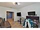 Spacious living area with wood floors, featuring a flat-screen TV and comfortable couches perfect for relaxing at 2221 W Madisen Marie Ave, Queen Creek, AZ 85144