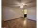 Bright bedroom with wood-look flooring and a view of the en-suite bathroom at 2233 E Behrend Dr # 84, Phoenix, AZ 85024