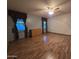 Spacious bedroom with wood-look flooring, a ceiling fan, and ample natural light at 2233 E Behrend Dr # 84, Phoenix, AZ 85024