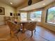 Cozy dining area with a table, four chairs, and large windows offering natural light at 2233 E Behrend Dr # 84, Phoenix, AZ 85024