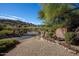 Community entrance featuring landscaping and a sign for Boulder Ridge on a sunny day at 2233 E Behrend Dr # 84, Phoenix, AZ 85024
