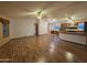 Large open living space with wood-look flooring and multiple ceiling fans for comfort at 2233 E Behrend Dr # 84, Phoenix, AZ 85024