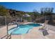 Inviting in-ground pool with lounge chairs and beautiful desert landscaping offers a serene outdoor oasis at 2233 E Behrend Dr # 84, Phoenix, AZ 85024