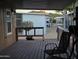 Relax on this charming covered porch with views of the community, perfect for enjoying the outdoors at 2233 E Behrend Dr # 84, Phoenix, AZ 85024
