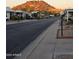 Residential street scene with mountain views and well-maintained landscaping at 2233 E Behrend Dr # 84, Phoenix, AZ 85024