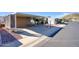 A mobile home is shown with covered parking and a fire hydrant, surrounded by desert landscaping at 2233 E Behrend Dr # 84, Phoenix, AZ 85024