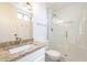 Clean bathroom features a granite vanity, white tile and a large glass walk-in shower at 22420 N 20Th Pl, Phoenix, AZ 85024