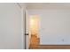 A bedroom with wood flooring, a closet, and access to the ensuite bathroom at 22420 N 20Th Pl, Phoenix, AZ 85024