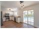 Modern kitchen with stainless steel appliances, granite counters, and access to the backyard pool area at 22420 N 20Th Pl, Phoenix, AZ 85024