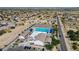 Community center with outdoor pool, ample parking, and desert landscaping, offering a resort-like environment at 2412 W Camp River Rd, San Tan Valley, AZ 85144
