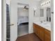 This bathroom is connected to the bedroom with double sinks and a tiled floor at 2412 W Camp River Rd, San Tan Valley, AZ 85144