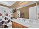 Bathroom with shower, mirror, sink, and toilet, all with beige, neutral colors at 2412 W Camp River Rd, San Tan Valley, AZ 85144