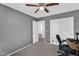 Bedroom featuring neutral carpet, gray walls, and double closet doors at 2412 W Camp River Rd, San Tan Valley, AZ 85144