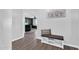 Bright entryway showcasing laminate flooring and a stylish storage bench with decorative 'gather' pillow at 2412 W Camp River Rd, San Tan Valley, AZ 85144