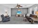 Comfortable living room with stylish decor, plush seating, and a modern entertainment center at 2412 W Camp River Rd, San Tan Valley, AZ 85144