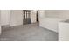 Neutral loft space with carpet and large cabinet at 2412 W Camp River Rd, San Tan Valley, AZ 85144