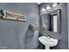Nice powder room with sink and mirror, decorated with a 'Have Faith' sign at 2412 W Camp River Rd, San Tan Valley, AZ 85144