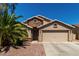 Charming single-Gathering home featuring a desert-style landscape, a two-car garage, and a neutral color palette at 24806 W Hidalgo Dr, Buckeye, AZ 85326