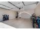 Spacious garage with epoxy flooring, ample storage and access door at 24806 W Hidalgo Dr, Buckeye, AZ 85326