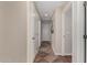 Hallway with neutral-toned walls and decorative tile flooring at 24806 W Hidalgo Dr, Buckeye, AZ 85326