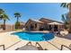 Relaxing backyard pool area with lounge chairs and mature landscaping creating a private oasis at 24806 W Hidalgo Dr, Buckeye, AZ 85326