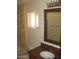 The bathroom showcases a granite countertop and a framed mirror at 27239 N 64Th Way, Scottsdale, AZ 85266
