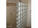 This bathroom features glass block wall, tile surround, and overhead shower head at 27239 N 64Th Way, Scottsdale, AZ 85266