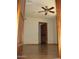 This bedroom has hardwood floors and a ceiling fan at 27239 N 64Th Way, Scottsdale, AZ 85266