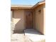 Close up on the front door and address number of this charming tan home at 27239 N 64Th Way, Scottsdale, AZ 85266