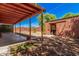 View of the backyard with a covered patio, a small shed, and landscaping at 2750 W Turney Ave, Phoenix, AZ 85017