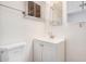 Bright bathroom featuring a white vanity with a modern faucet and updated fixtures at 2750 W Turney Ave, Phoenix, AZ 85017