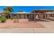 Charming single-story home with a covered carport and low maintenance desert landscaping at 2750 W Turney Ave, Phoenix, AZ 85017