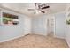 This living room features tile floors, a ceiling fan, and neutral wall colors at 2750 W Turney Ave, Phoenix, AZ 85017