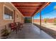 Covered patio with a concrete floor and seating area at 2750 W Turney Ave, Phoenix, AZ 85017