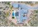 Private desert estate with a sparkling pool, patio area, lush desert landscaping, and separate garage at 31226 N Granite Reef Rd, Scottsdale, AZ 85266