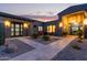 Desert home courtyard featuring desert landscaping and outdoor seating at twilight at 31226 N Granite Reef Rd, Scottsdale, AZ 85266