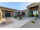 Inviting courtyard with desert landscaping and comfortable outdoor seating that enhances the home's curb appeal at 31226 N Granite Reef Rd, Scottsdale, AZ 85266