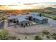 Stunning desert home with modern design, desert landscaping, and beautiful mountain views at sunset at 31226 N Granite Reef Rd, Scottsdale, AZ 85266