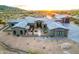 Stunning luxury home featuring desert landscaping, tile roof, and gray painted stucco at 31226 N Granite Reef Rd, Scottsdale, AZ 85266