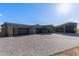 Stunning single-story home with a four-car garage, elegant stucco exterior, and paved driveway at 31226 N Granite Reef Rd, Scottsdale, AZ 85266
